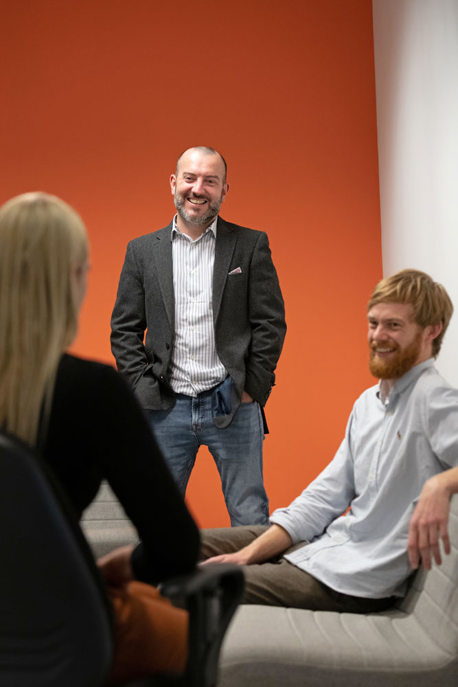 Three members of staff in discussion