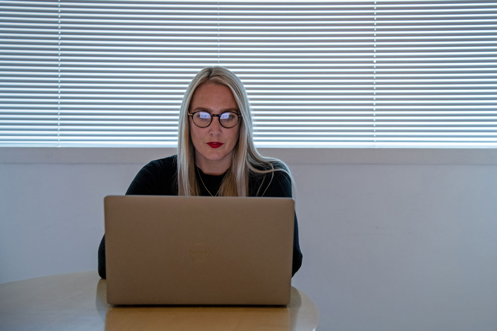 Woman looking at laptop screen